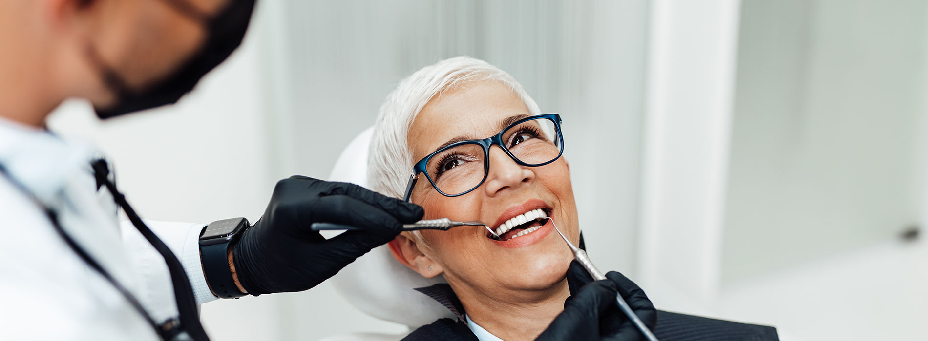 A hairstylist working on a client s hair in a salon setting.