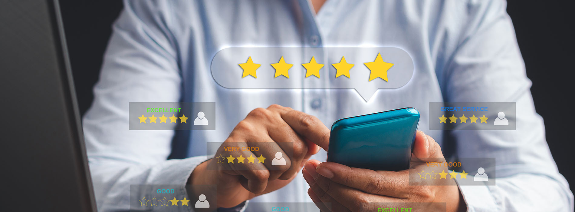 A man in a blue shirt is holding a smartphone with his left hand, displaying a screen with multiple star ratings and social media icons.